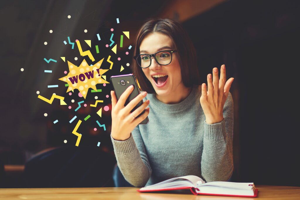 woman excited to see something on her phone